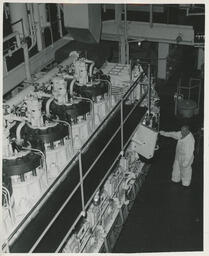 Person at row of machines