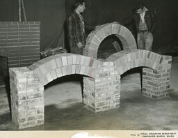 Plastering students with brick arches, ca. 1955