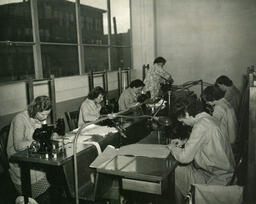 Class of students at sewing machines