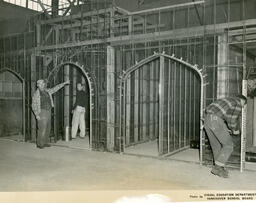 Plastering students working on scaffolding, ca. 1955