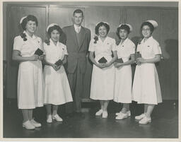 Indigenous Graduating Practical Nursing Students with Mr. Ratcliffe of Dept. of Indian Affairs, December 1957