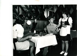 Server pointing to menu, ca. 1972