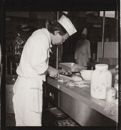 Student chef working in kitchen
