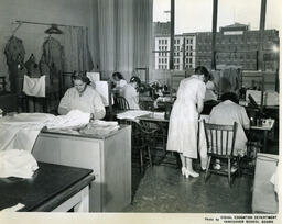 Students in sewing classroom with large window