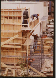 Carpentry students work on wooden frame, ca. 1980