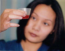Nursing student holding a sample