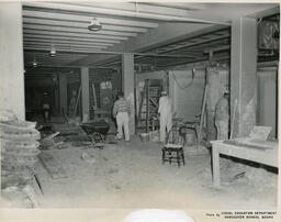 Plastering students in large work space, ca. 1955