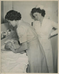 Practical Nursing student gives newborn baby a bath