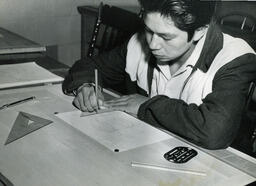 Student working on drafting design, ca. 1956