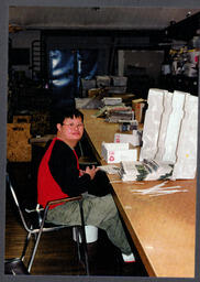 Student folding flyers