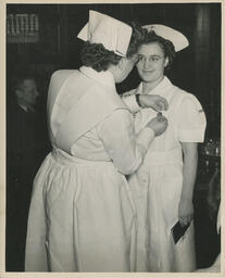 Student gets a pin on her uniform