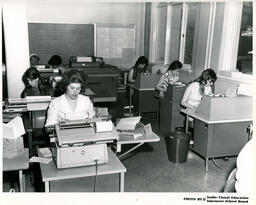 Students typing in a classroom, ca. 1970