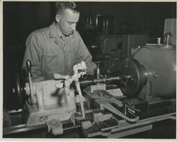 Student working with a spinning machine, ca. 1949