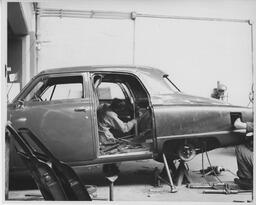 Student working in a car