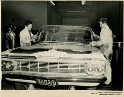 Replacing a car windshield, ca. 1960