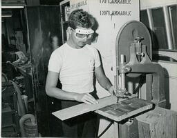 Student working with a jigsaw machine