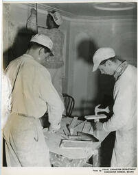 Plastering students at a work table, ca. 1955
