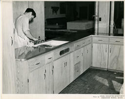 Student working on kitchen construction project, ca. 1954