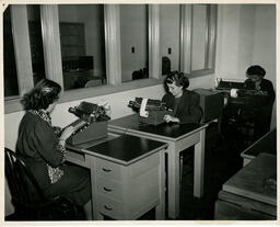 Students typing at desks, ca. 1949