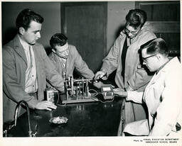 Students with a charging device, ca. 1962
