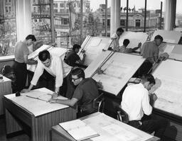 Group of students working on designs at drafting tables, ca. 1963