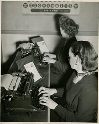 Two students doing typing drills, ca. 1950