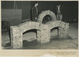 Plastering students look at brick arch, ca. 1955
