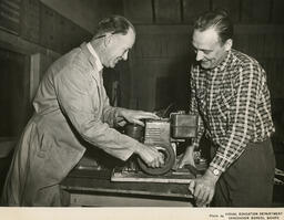 Two people with a small machine, ca. 1960