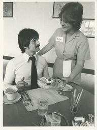 Customer being served a fruit plate