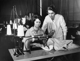 Student and instructor at sewing machine
