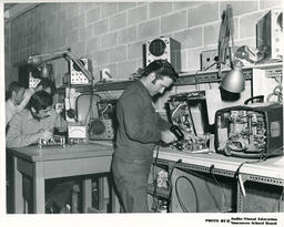 Students working with TV and radio equipment