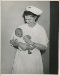 Nurse holding a baby
