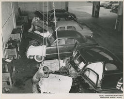 Cars in an auto shop classroom, ca. 1953