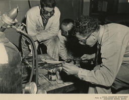 Students with blowtorch and goggles, ca. 1954