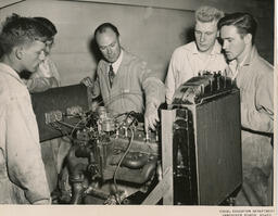 Students looking at machinery, ca. 1953