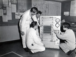 Students inspect a refrigeration machine