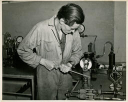 Diesel student at a machine, ca. 1950