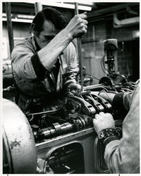 Student works on diesel engine, ca. 1975