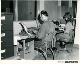 Two students working on typewriters, ca. 1972