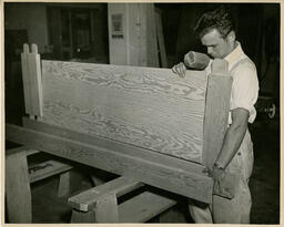 Student working on bedframe, ca. 1950
