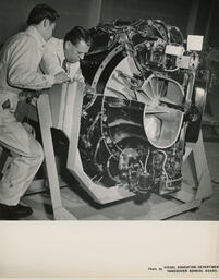 Diesel student and instructor with a large engine, ca. 1957