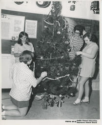 Decorating a Christmas tree