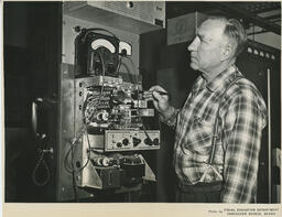 Navigation student working on machinery, ca. 1960