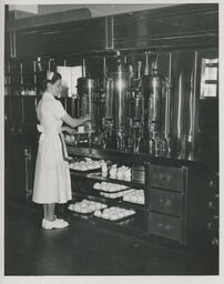 Server at a coffee machine, ca. 1949