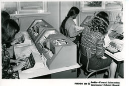 Students working on typing machines, ca. 1972