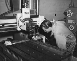 Diesel student examines machine, ca. 1949