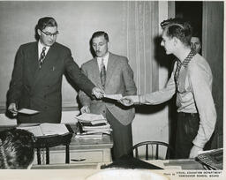 Plastering student receiving a diploma, ca. 1955
