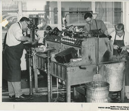 Students in a shoe repair classroom