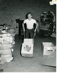 Student uses trolley to move boxes