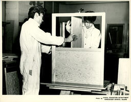Students working on a cabinet frame, ca. 1960